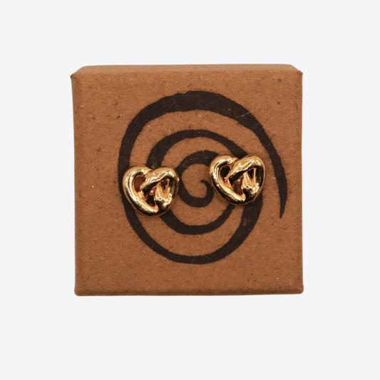 Pair of gold heart-shaped earrings .