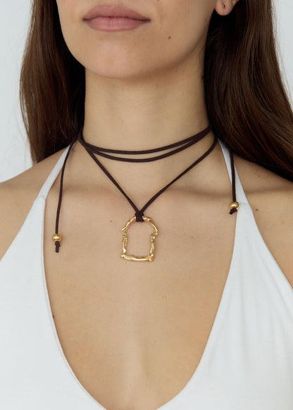 Necklace with a gold pendant on a white background