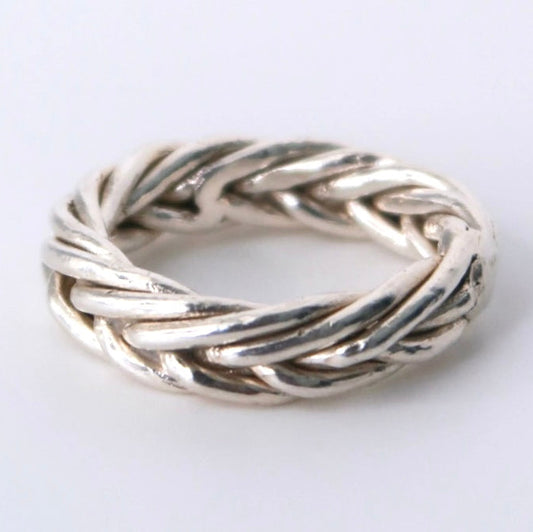 Silver braided ring on a white background