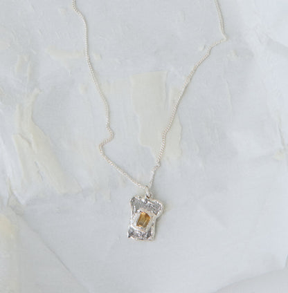 bread and butter silver pendant on necklace 